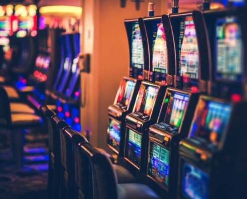 illuminated slot machines in darkroom 948708294 afaf089a8c7b4299aae1e1d70643a14c